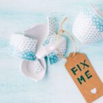 broken cup tagged "Fix me"
