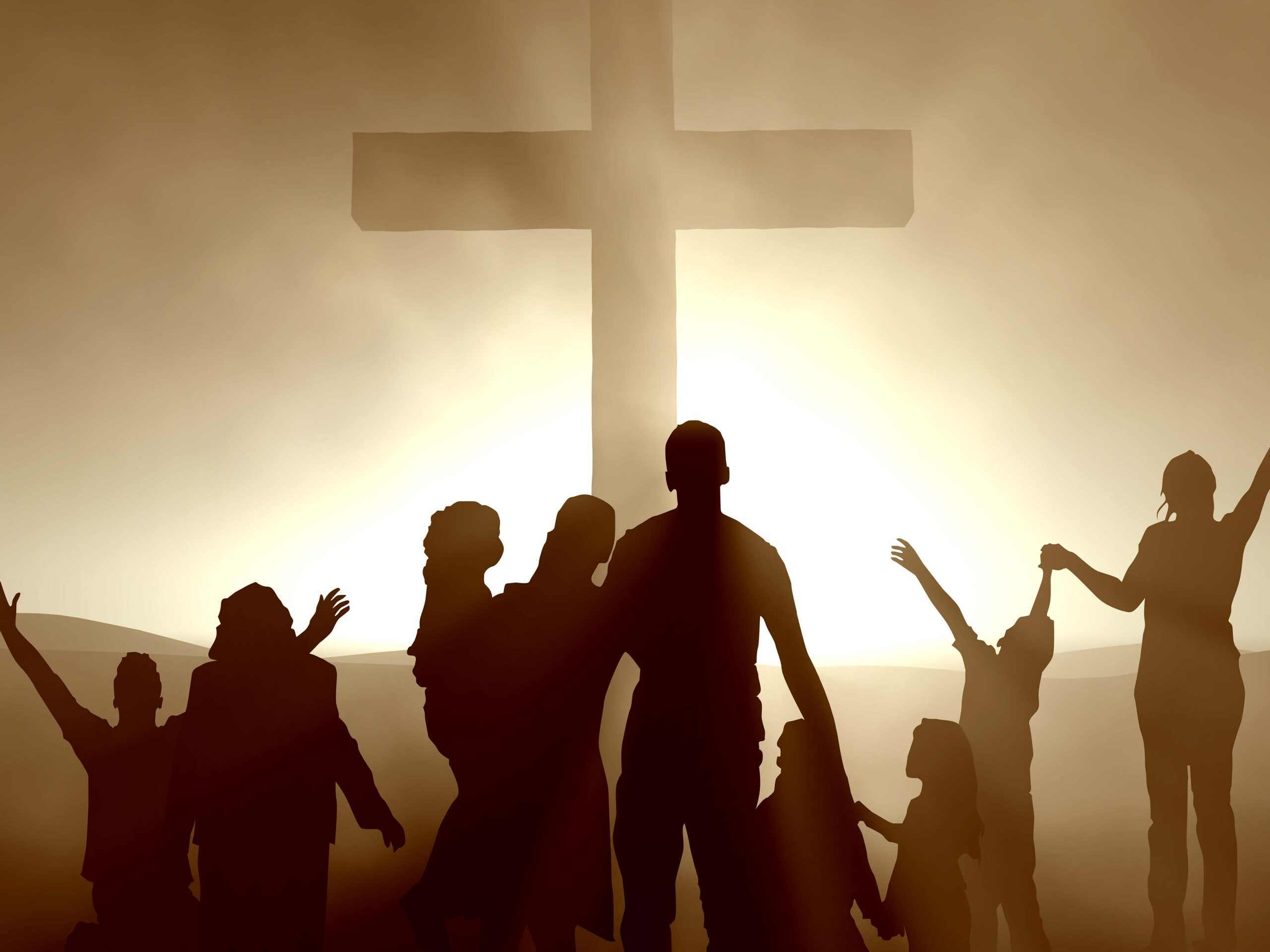 silhouettes of people in front of empty cross