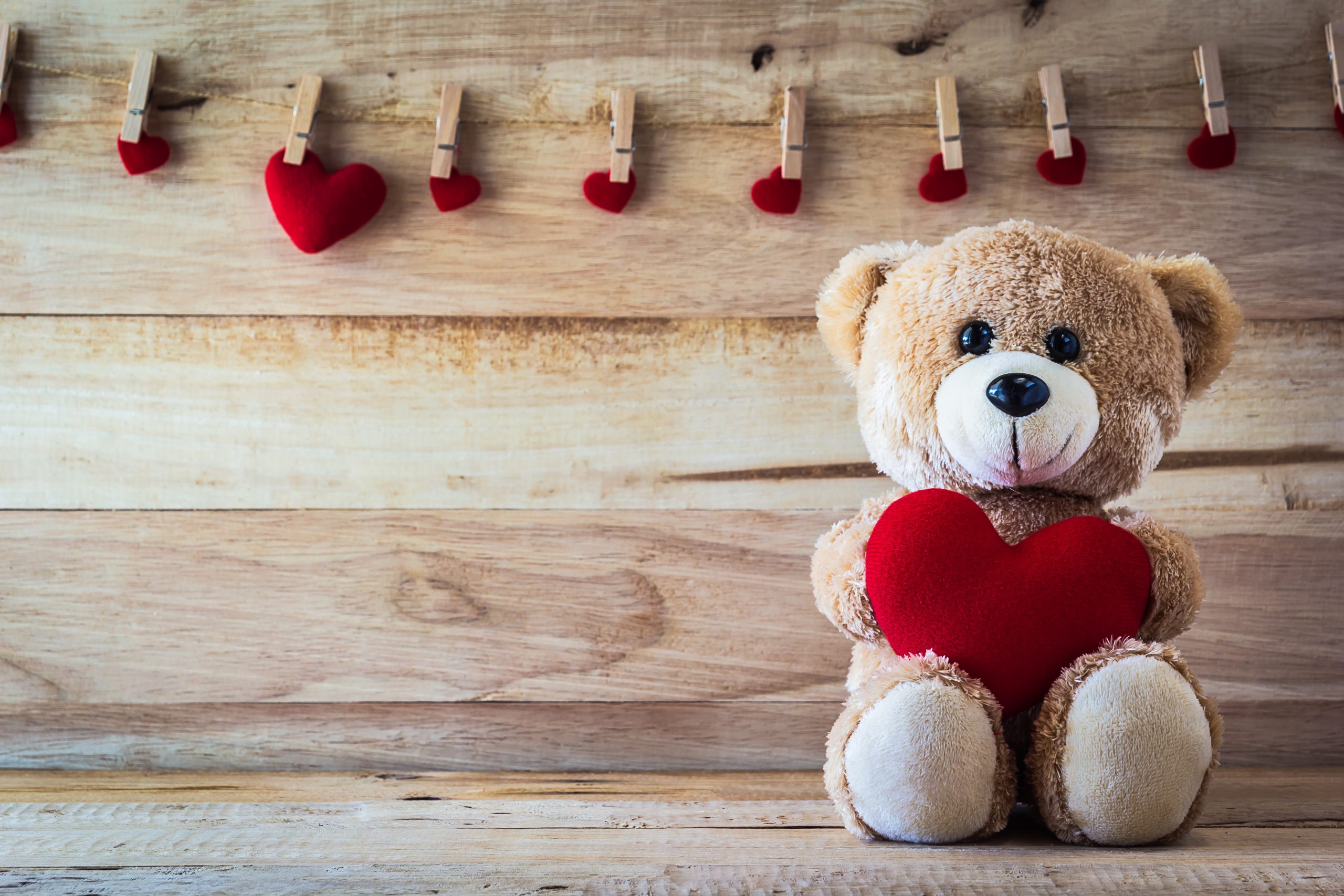 teddy bear with red hearts